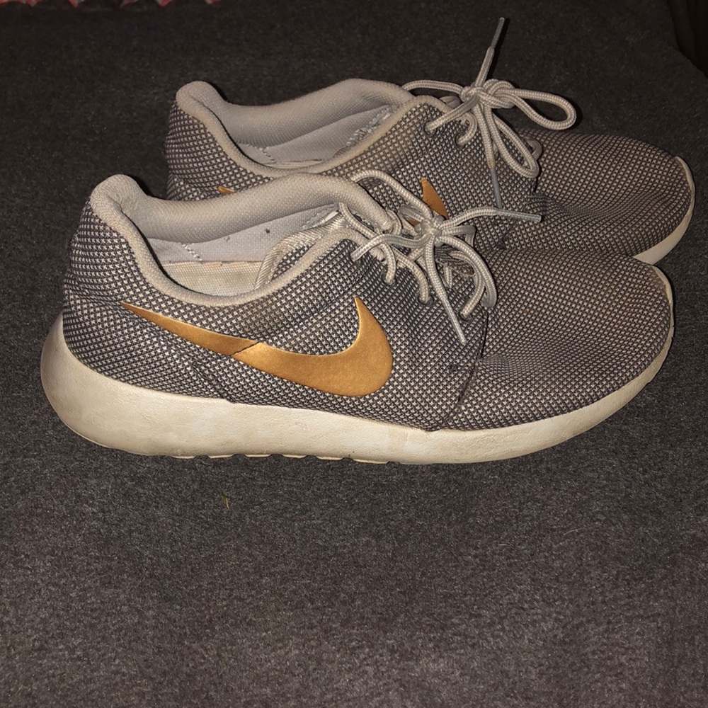 Nike Roshe grey with gold swoosh